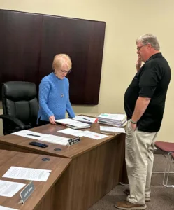 Busti swears in new board member